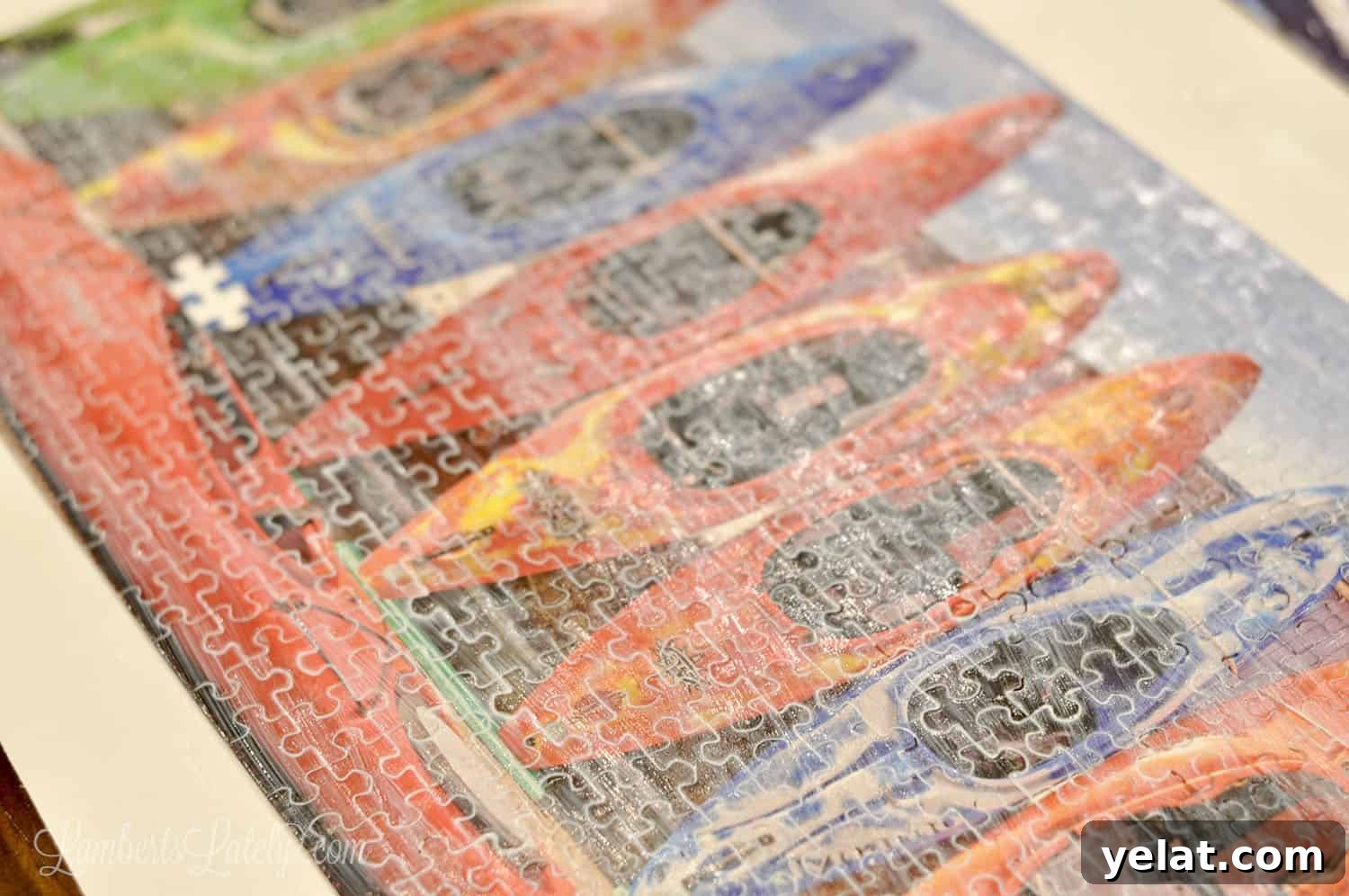 How to Glue and Hang a Puzzle Without a Frame 7 mod podge brushed onto the front of a puzzle, slightly cloudy before drying.