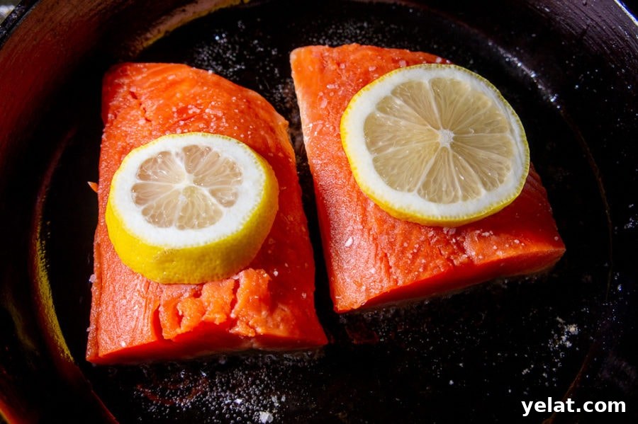 Crispy Cast-Iron Salmon with Lemon Herb Butter 3 two salmon filets in a cast iron pan