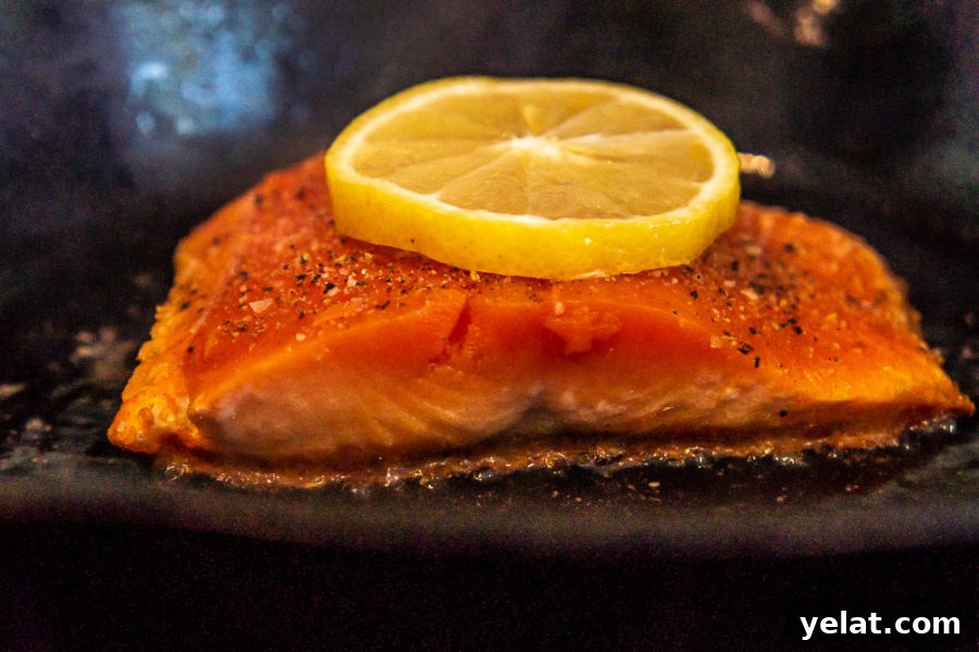 Crispy Cast-Iron Salmon with Lemon Herb Butter 4 salmon cooking in a cast iron pan
