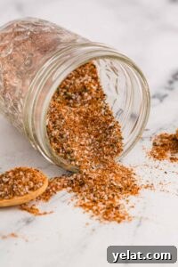 15 Homemade Seasoning Recipes to Transform Your Cooking 7 Steak Seasoning coming out of mason jar tipped over on counter