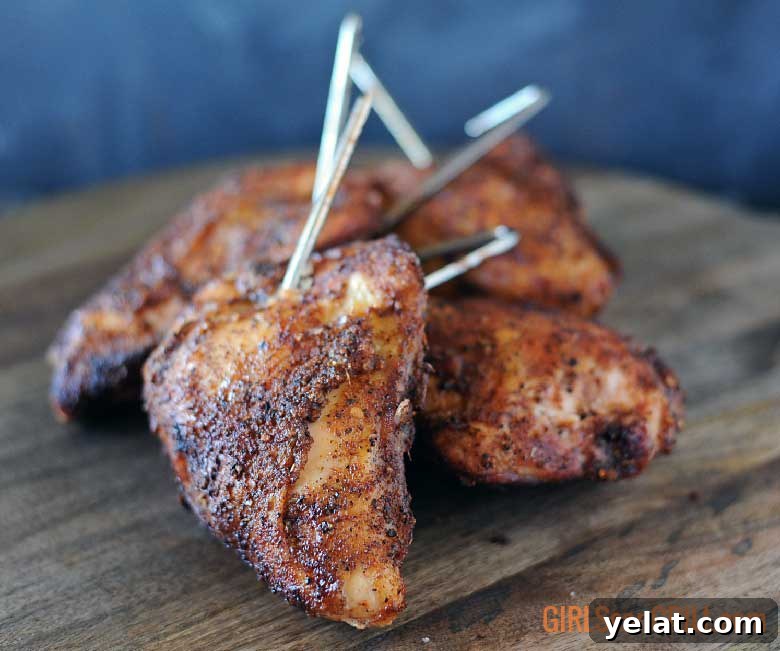 Barrel House Cooker 18C Review: Features, Performance & Verdict 15 wood platter with smoked chicken with hooks in them from hanging in smoker