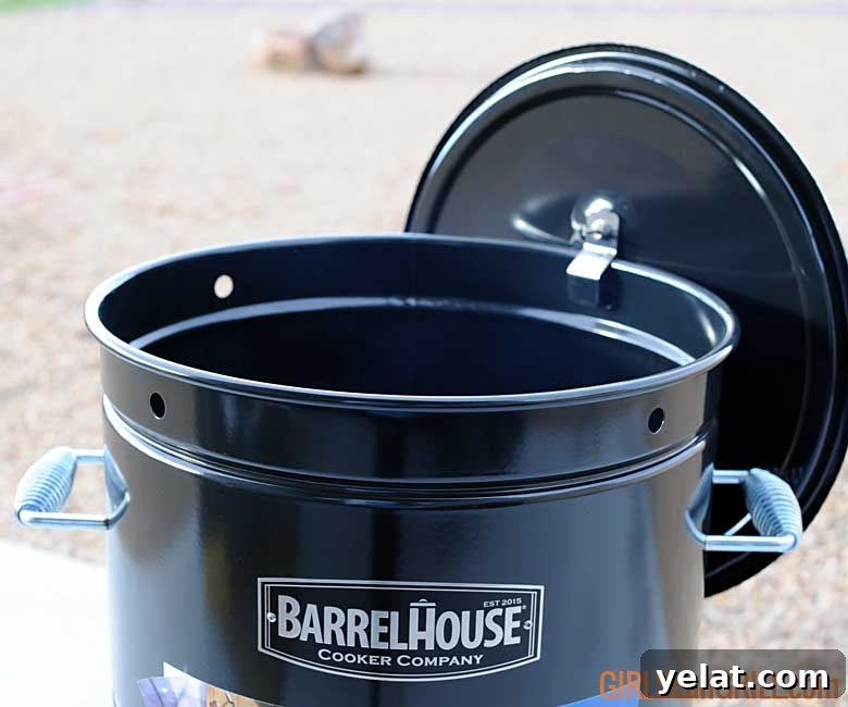 Barrel House Cooker 18C Review: Features, Performance & Verdict 10 lid hanging on side of grill