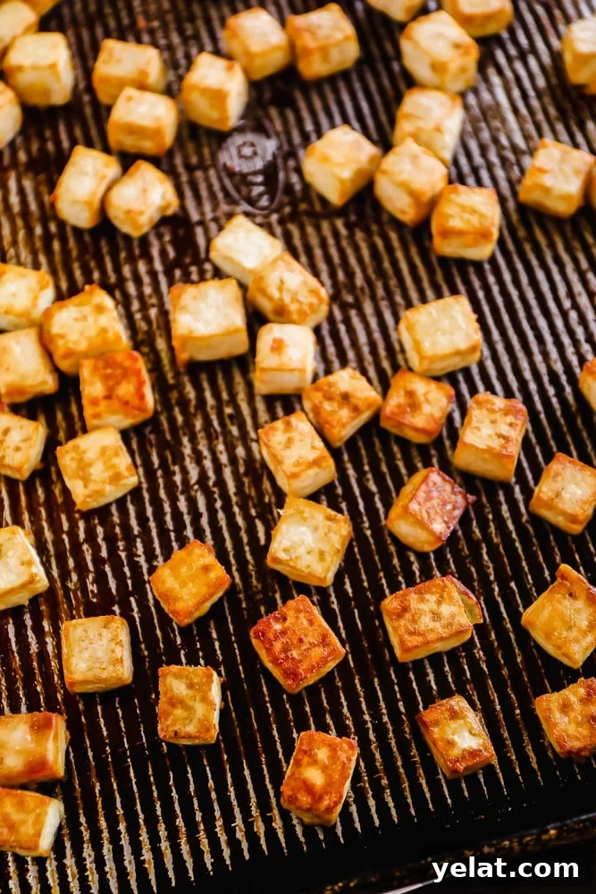baked tofu cubes on a baking sheet.