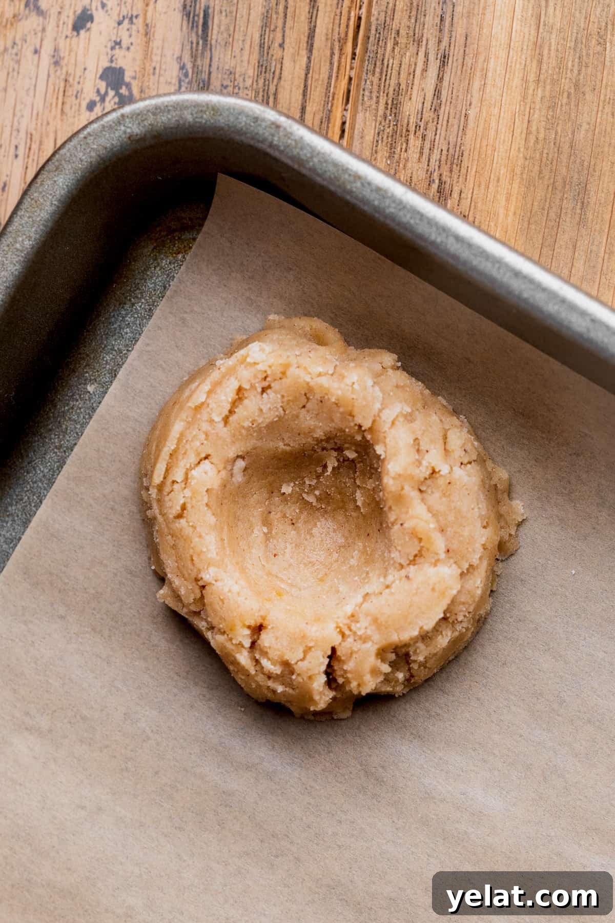 Pecan Pie Cookie Recipe: Crispy, Gooey Mini Pies 7 Cookie dough ball with a hole in the middle.