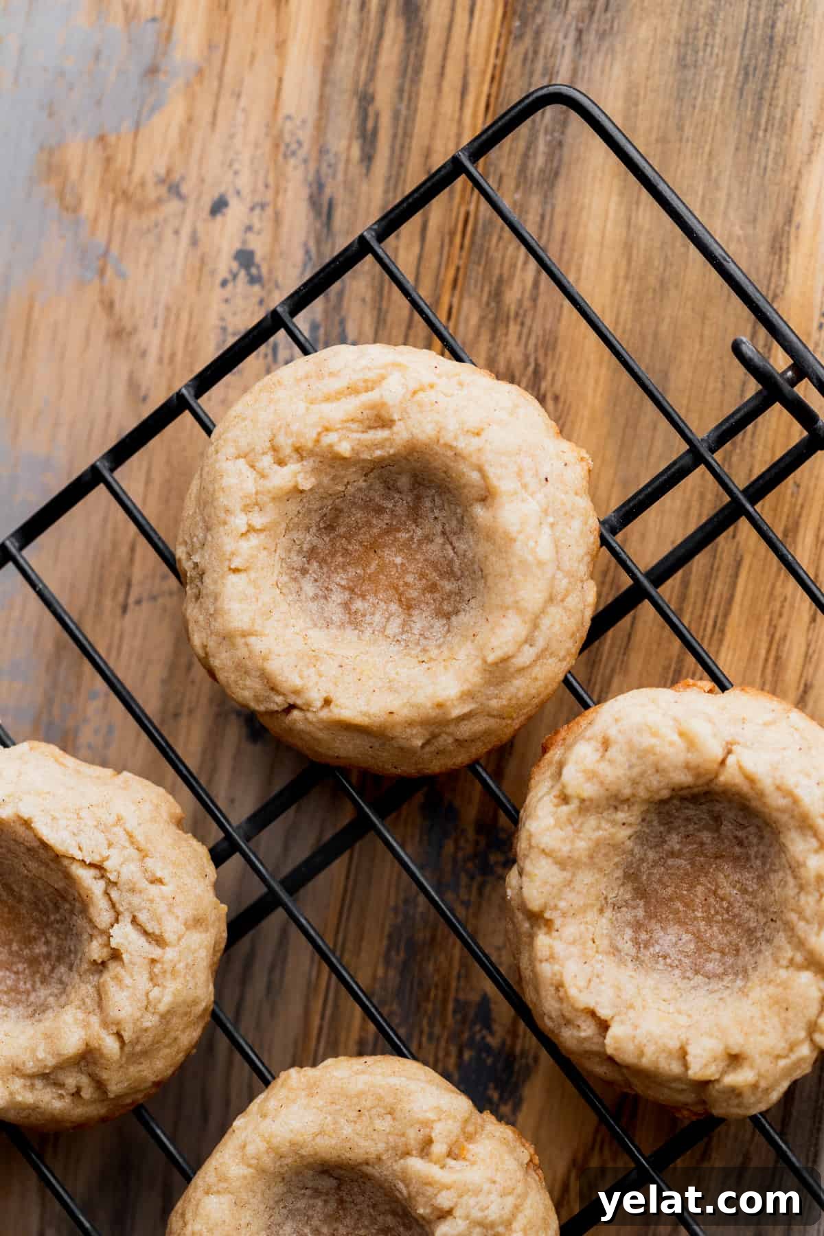 Pecan Pie Cookie Recipe: Crispy, Gooey Mini Pies 9 Baked cookies on a wire rack.