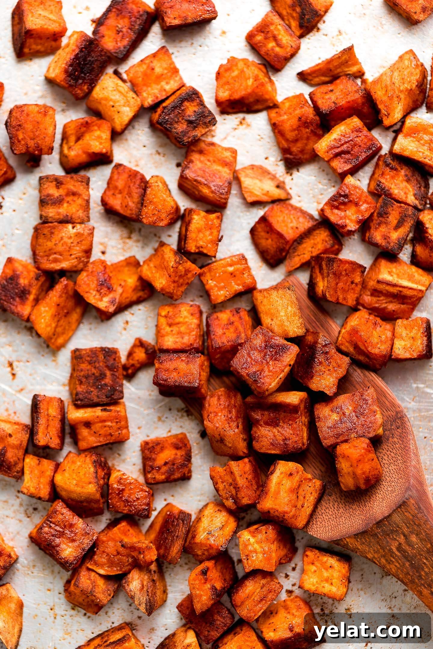 Crispy Roasted Sweet Potatoes with Garlic and Herbs 6 Close up of cubes of seasoned Roasted Sweet Potatoes.