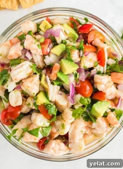 Authentic Mexican Red Rice Recipe: Fluffy, Flavorful Arroz Roja 12 Overhead of shrimp ceviche in glass bowl.