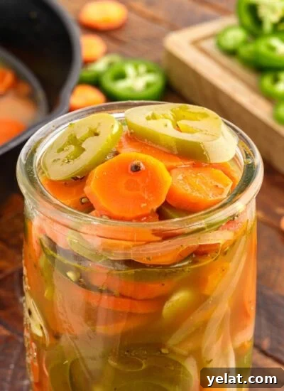 Authentic Mexican Red Rice Recipe: Fluffy, Flavorful Arroz Roja 13 Close up of a jar of Pickled Jalapeños and Carrots.