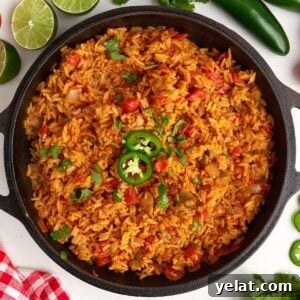 Authentic Mexican Red Rice Recipe: Fluffy, Flavorful Arroz Roja 14 Pan of cooked Mexican Red Rice ready to serve and eat.