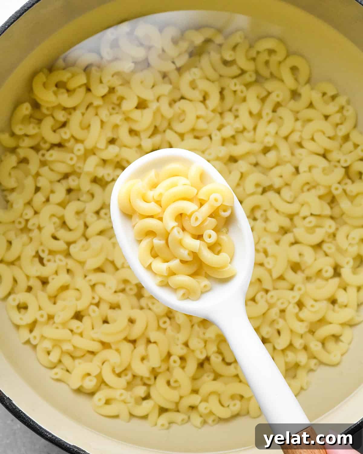 pasta cooking to make Vegetable Mac and Cheese