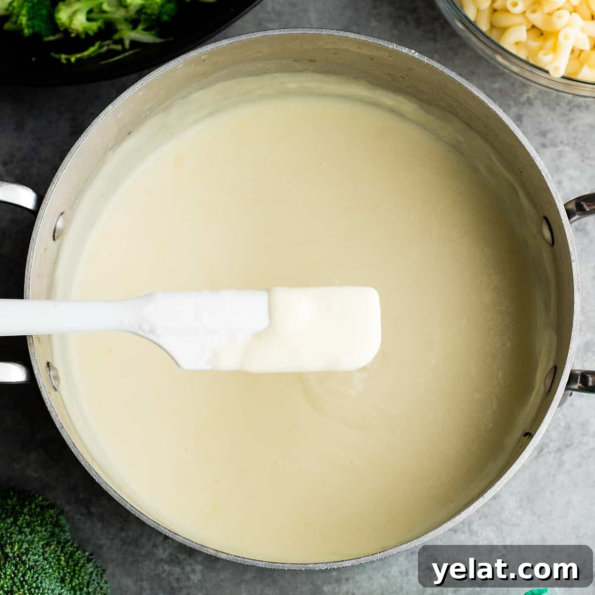 overhead view of the cheese sauce in vegetable mac and cheese