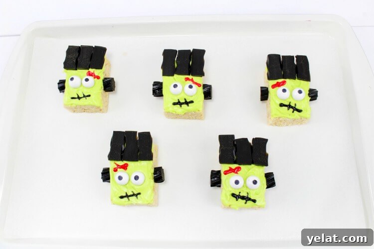 Finished Frankenstein Monster Rice Krispies Treats on a white tray.