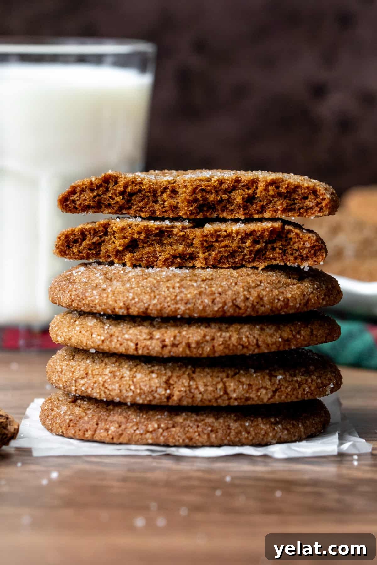 Crispy Gingersnaps: A Snappy Recipe for Perfect Cookies 5 Stack of gingersnap cookies, with top cookie broken in half and glass of milk
