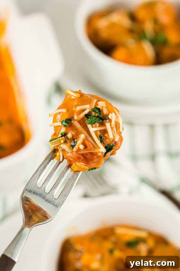 Zucchini Mini Pizzas: Bite-Sized Low-Carb Pizza Bites 14 fork holding up a bite of keto meatball casserole