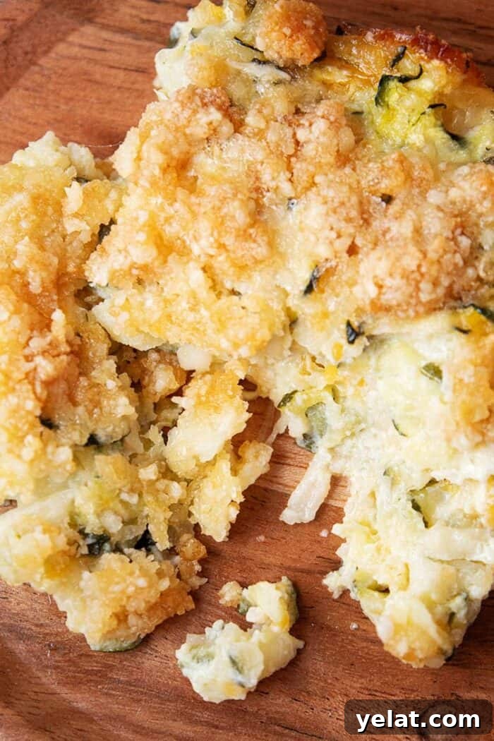 Zucchini Mini Pizzas: Bite-Sized Low-Carb Pizza Bites 8 overhead view of one serving of keto zucchini casserole on a wooden dish