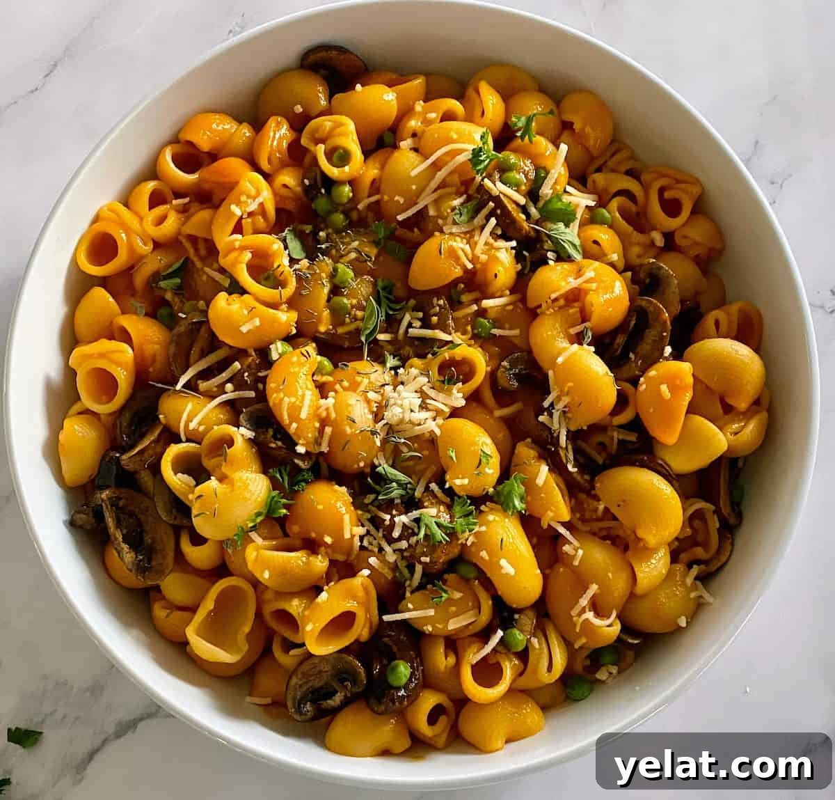 Creamy Roasted Red Pepper Pasta with Parmesan and Basil 2 red pepper pasta in a bowl