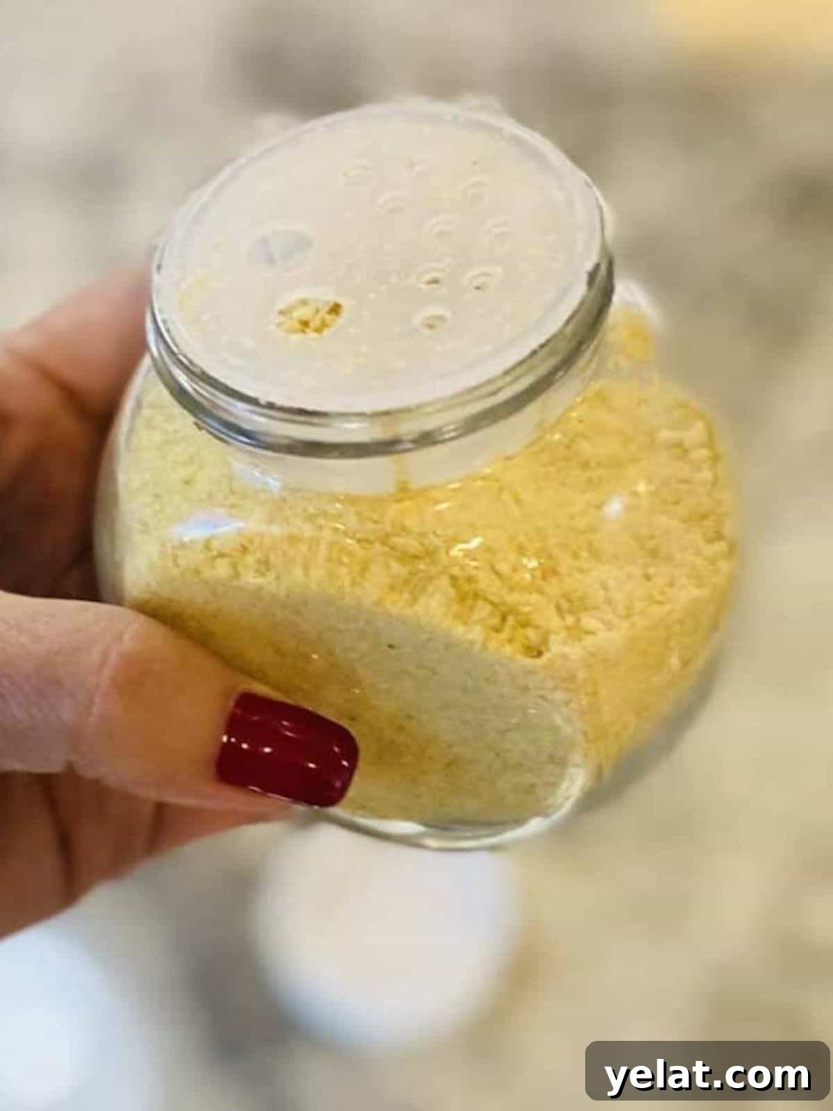 Creamy Roasted Red Pepper Pasta with Parmesan and Basil 11 vegan parmesan cheese in a shaker