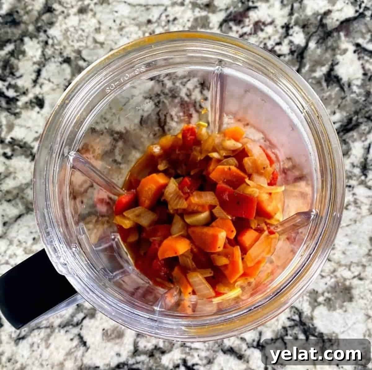 Creamy Roasted Red Pepper Pasta with Parmesan and Basil 8 roasted red pepper pasta sauce ingredients in a blender cup.