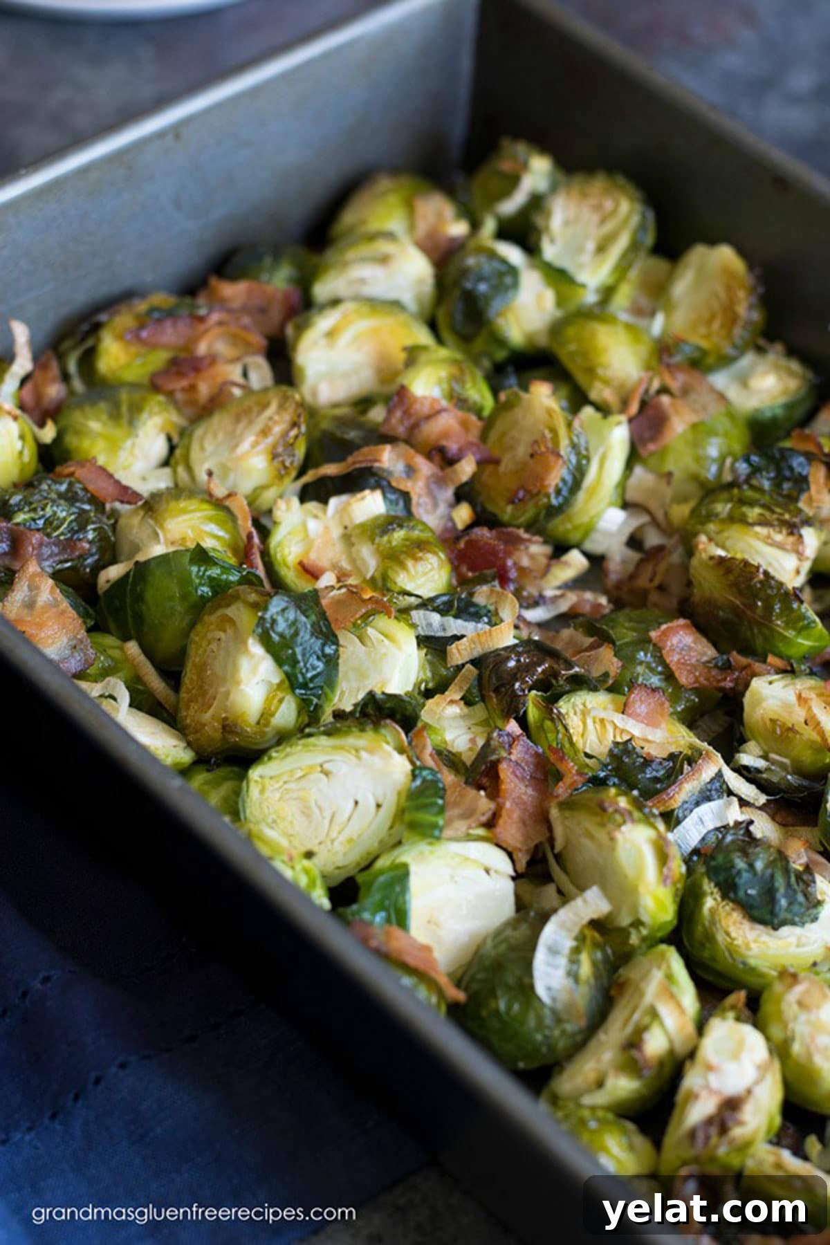 Grandma’s Crispy Bacon Brussels Sprouts Recipe 4 A roasting pan filled with roasted Brussels sprouts.
