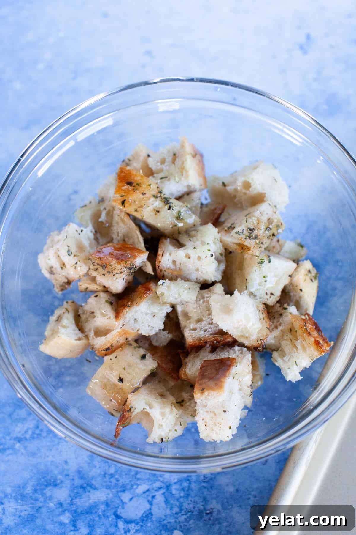 Crispy Homemade Croutons: Simple Recipe for Perfect Salads 7 Sourdough pieces tossed with oil and spices.