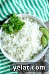 a white bowl of coconut rice recipe with cilantro and lime