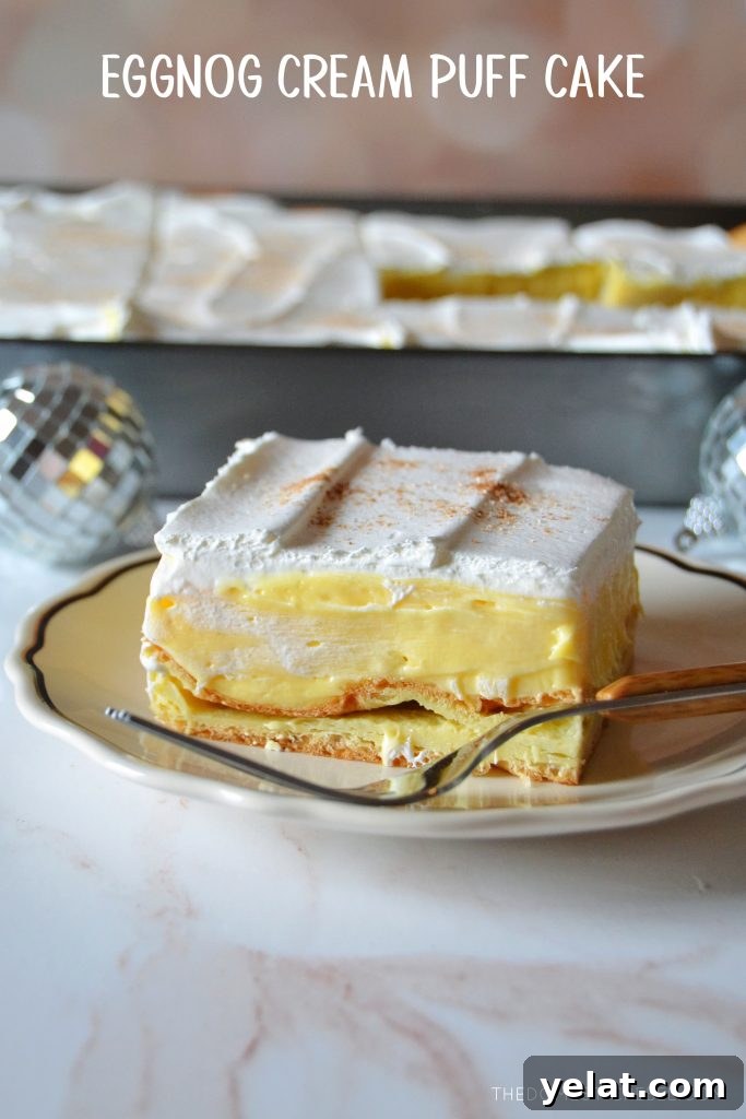 Quick Last-Minute Thanksgiving Desserts to Impress Guests 3 eggnog cream puff cake slice on a small white plate with a fork resting on it