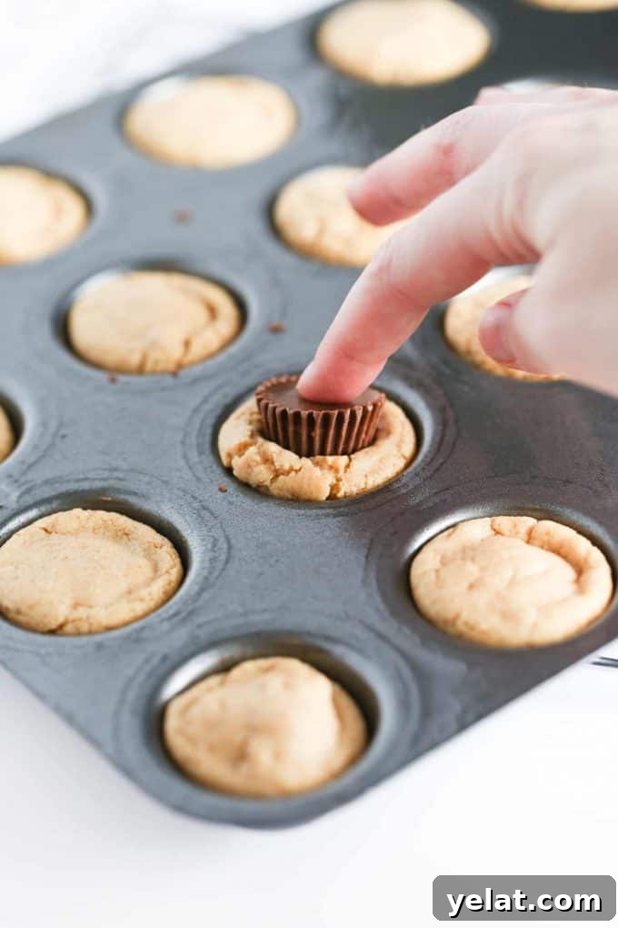 Press Reeses Peanut Butter Cups in Valentines Cookie Cups