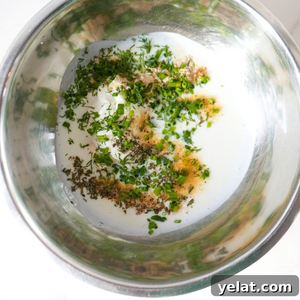 Creamy Buttermilk Ranch Dressing Recipe (Video Tutorial) 4 Homemade buttermilk ranch dressing ingredients in a mixing bowl.
