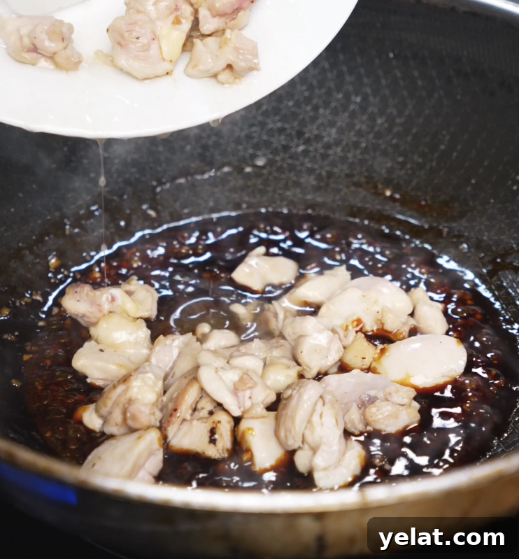 Garlic Butter Chicken Recipe with Crispy Pan-Seared Thighs 8 Browned chicken is added back into a glossy garlic butter sauce to be coated in the sweet and savory glaze.