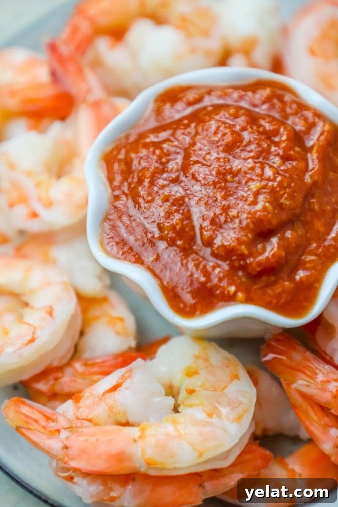 Shrimp cocktail recipe with sauce on a plate.