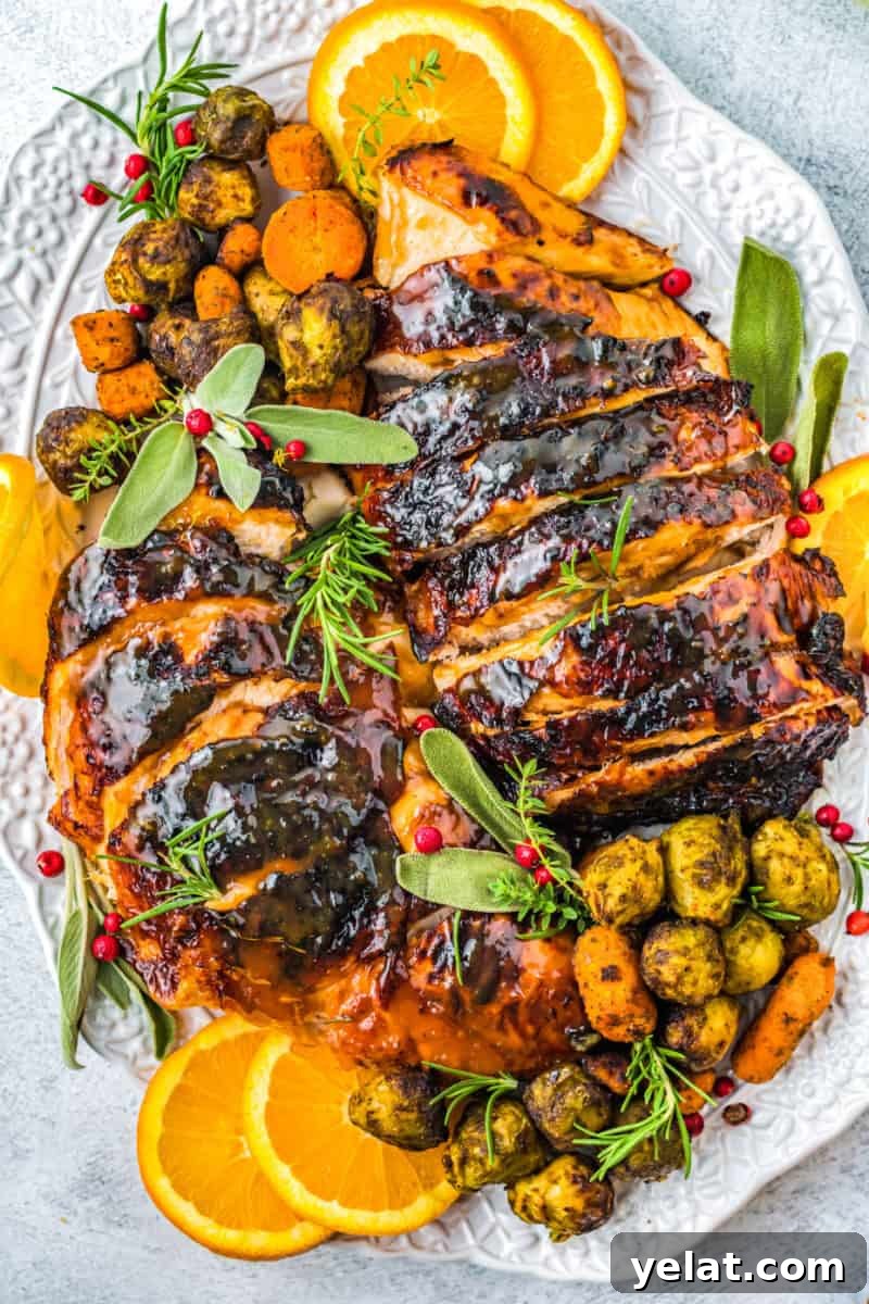 Glazed Turkey Breast in an Air Fryer: Juicy, Quick Recipe 2 air fryer turkey breast sliced and plated with herbs and orange slices