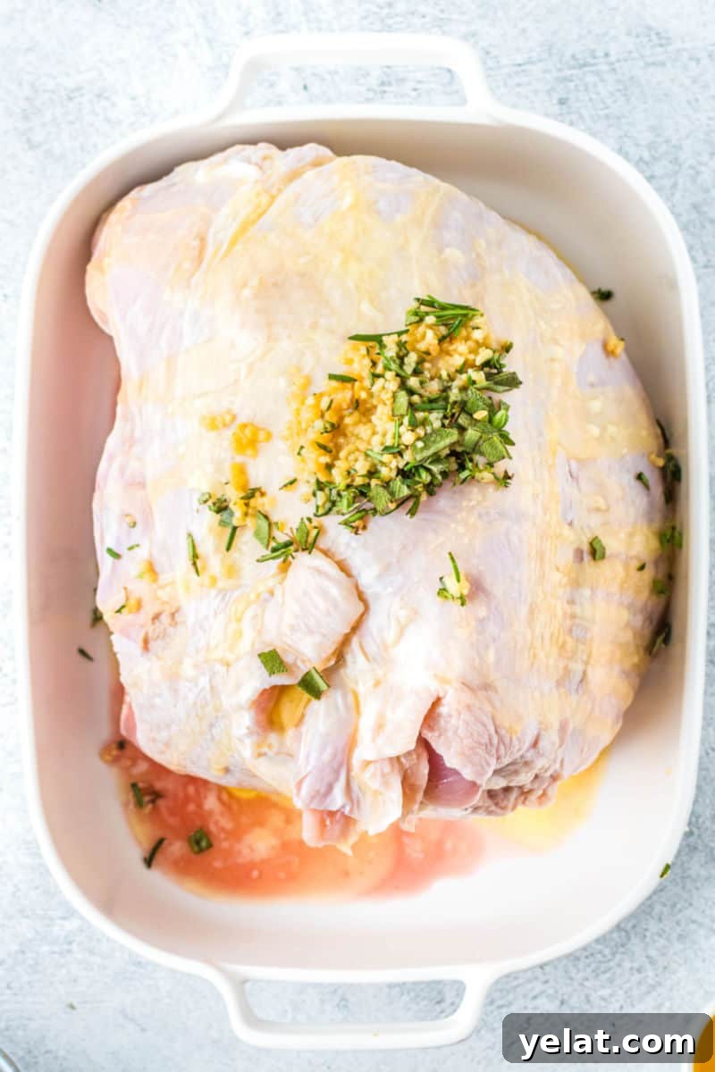 Glazed Turkey Breast in an Air Fryer: Juicy, Quick Recipe 5 turkey breast in a bakign dish with butter, galric, and herbs rubbed all over