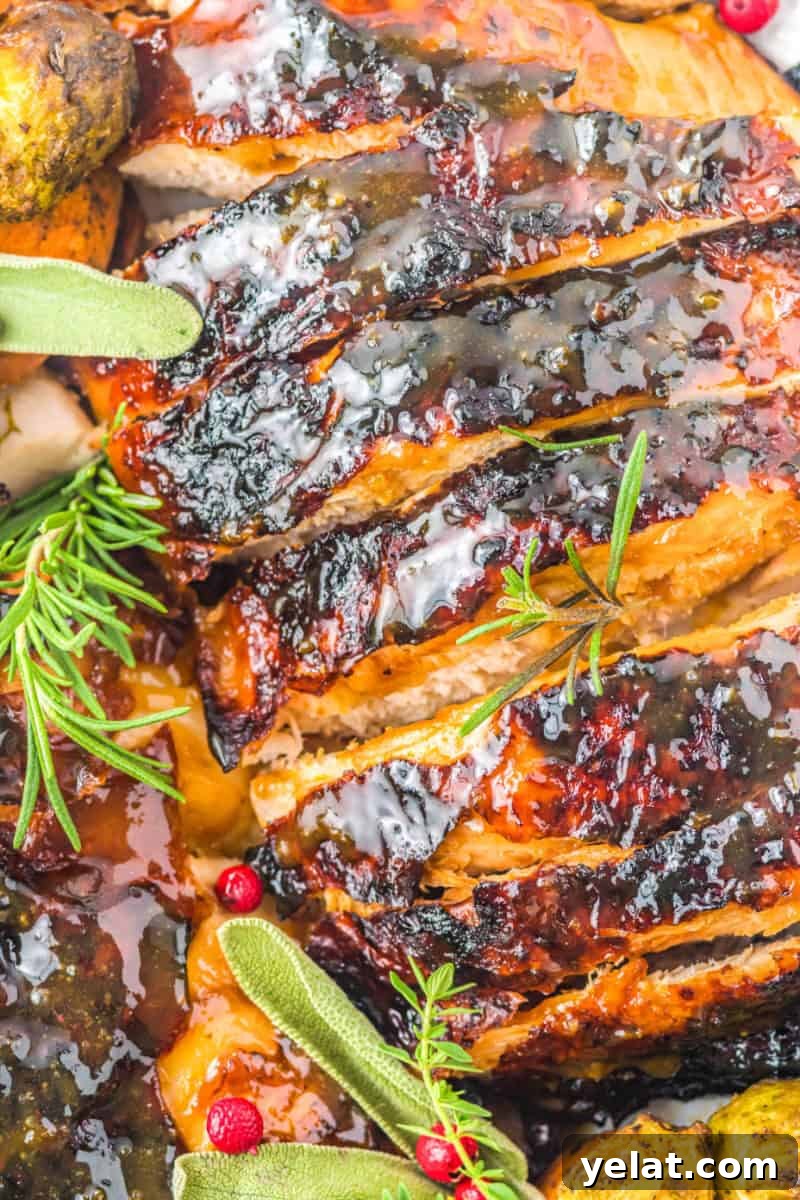 Glazed Turkey Breast in an Air Fryer: Juicy, Quick Recipe 10 close up of air fryer glazed turkey breast slices on a platter with fresh herbs