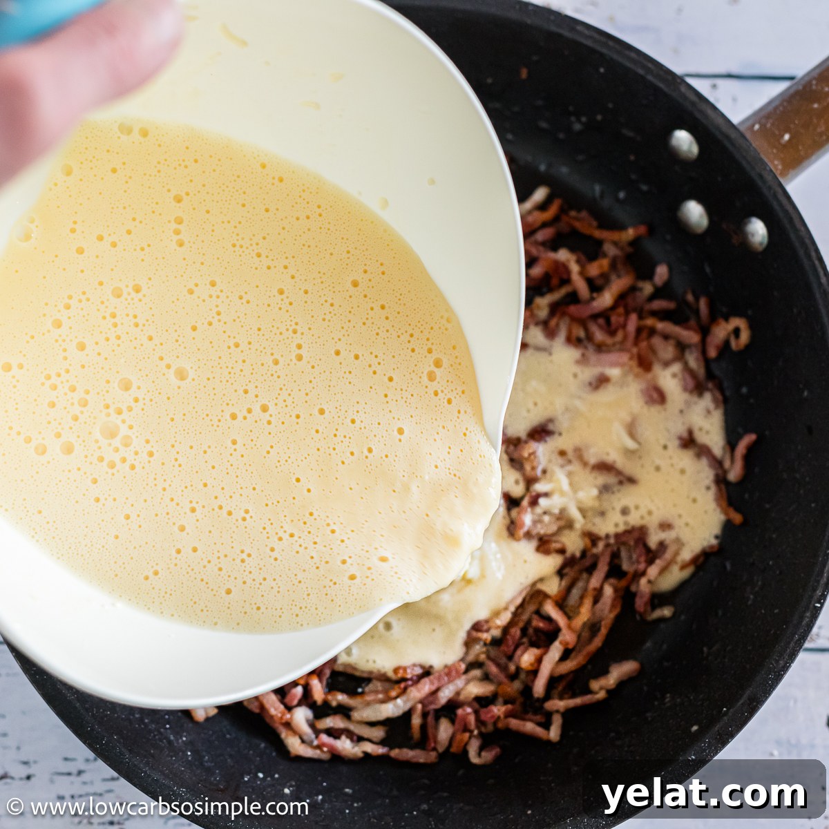 Bacon-and-Egg Skillet Pan Pie (Low-Carb Carnivore Recipe) 5 Pouring Egg and Cream Mixture over Bacon | Low-Carb, So Simple