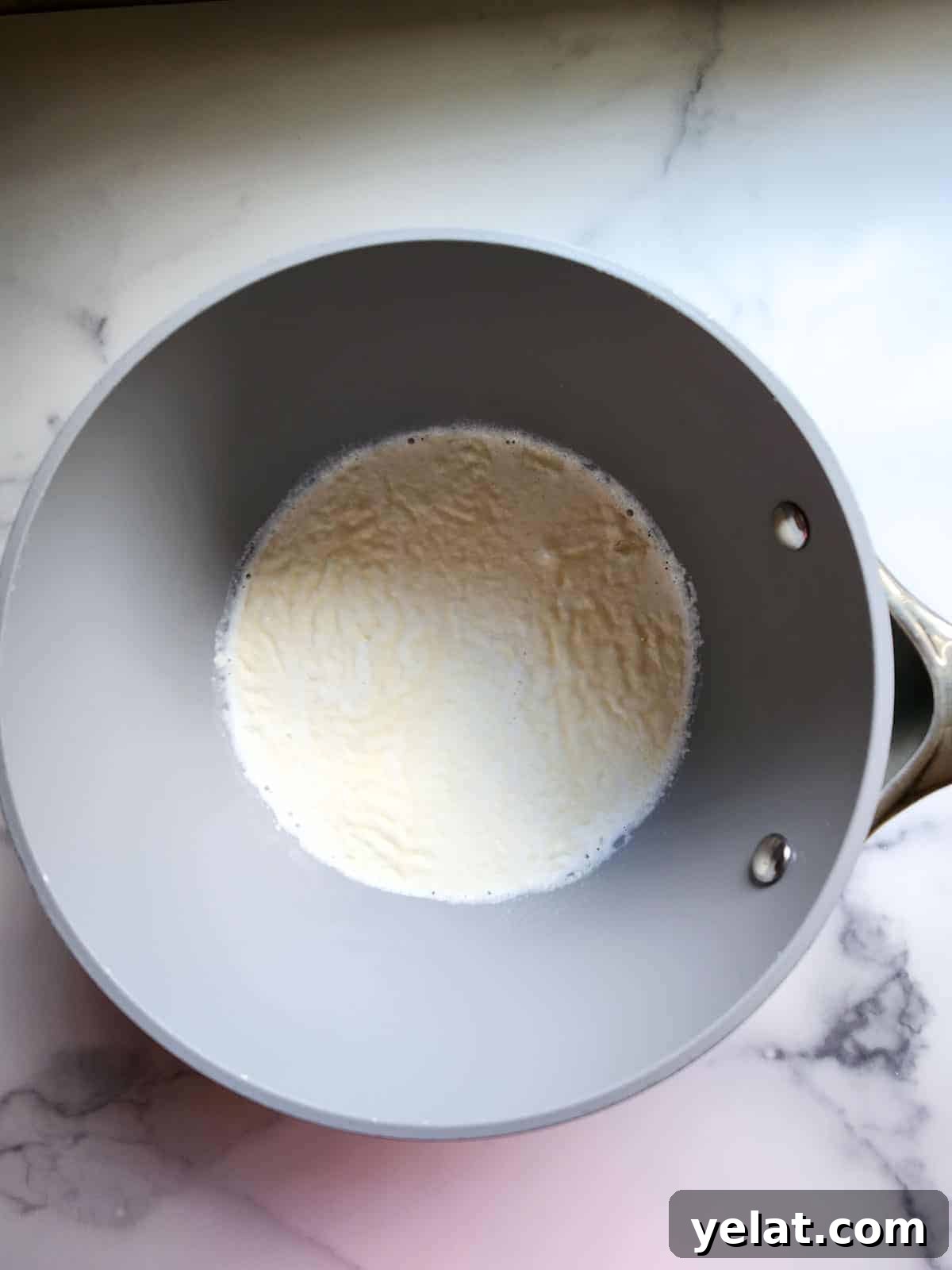 Gelatin sprinkled over half and half in a pot or panna cotta.