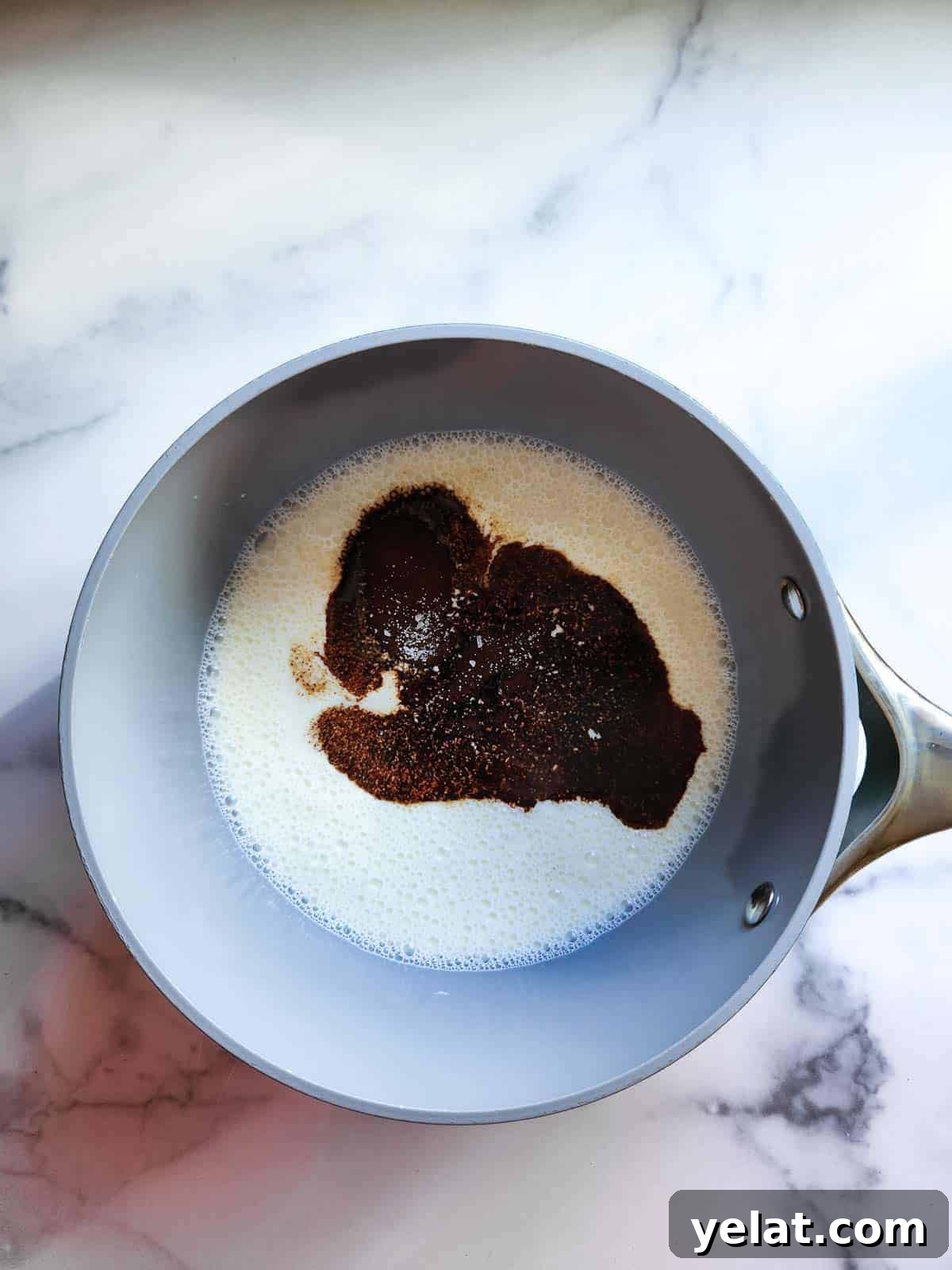 Prepared ingredients in a pot for espresso panna cotta.