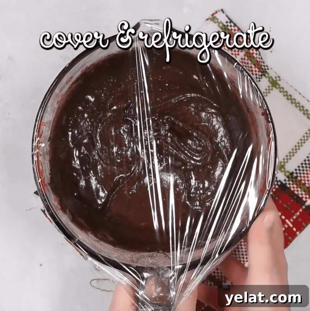 Chewy Chocolate Crinkle Cookies Recipe for Perfectly Soft Centers 7 covering cookie dough in plastic wrap to refrigerate