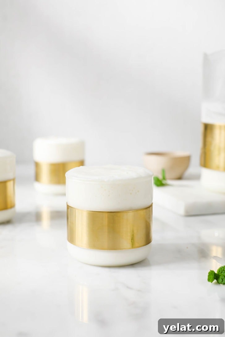 Authentic Sweet Lassi Recipe: Creamy Indian Yogurt Drink Guide 3 Sweet Lassi in clear glasses with a copper ring.