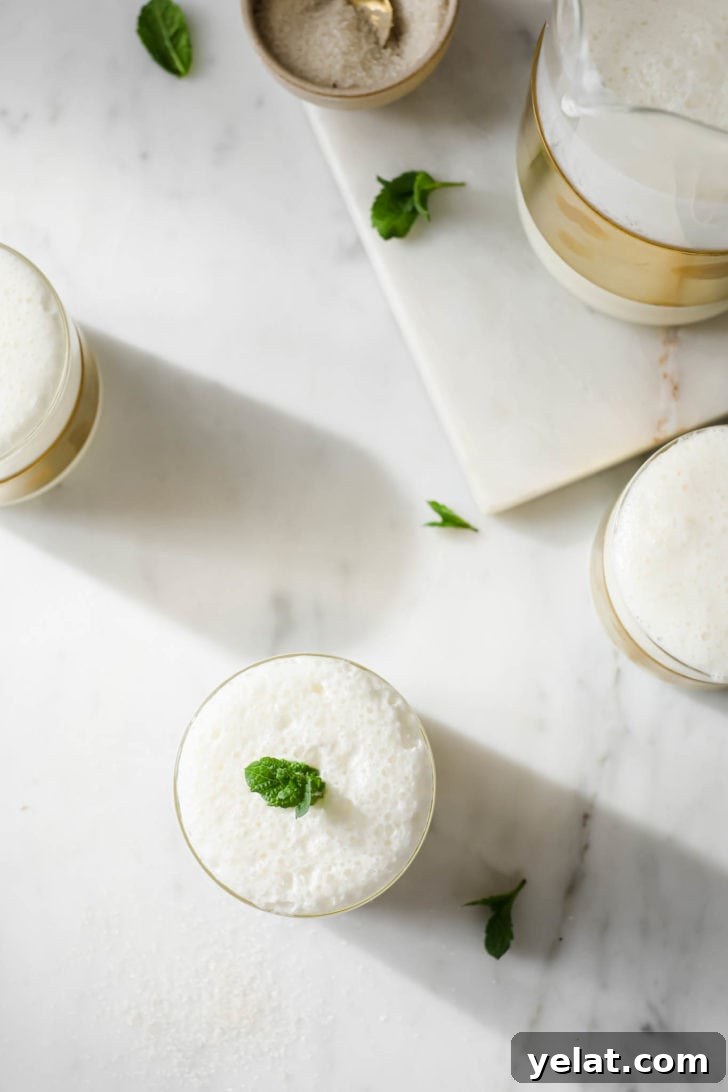Authentic Sweet Lassi Recipe: Creamy Indian Yogurt Drink Guide 5 Lassi in glasses with a jug on the side.
