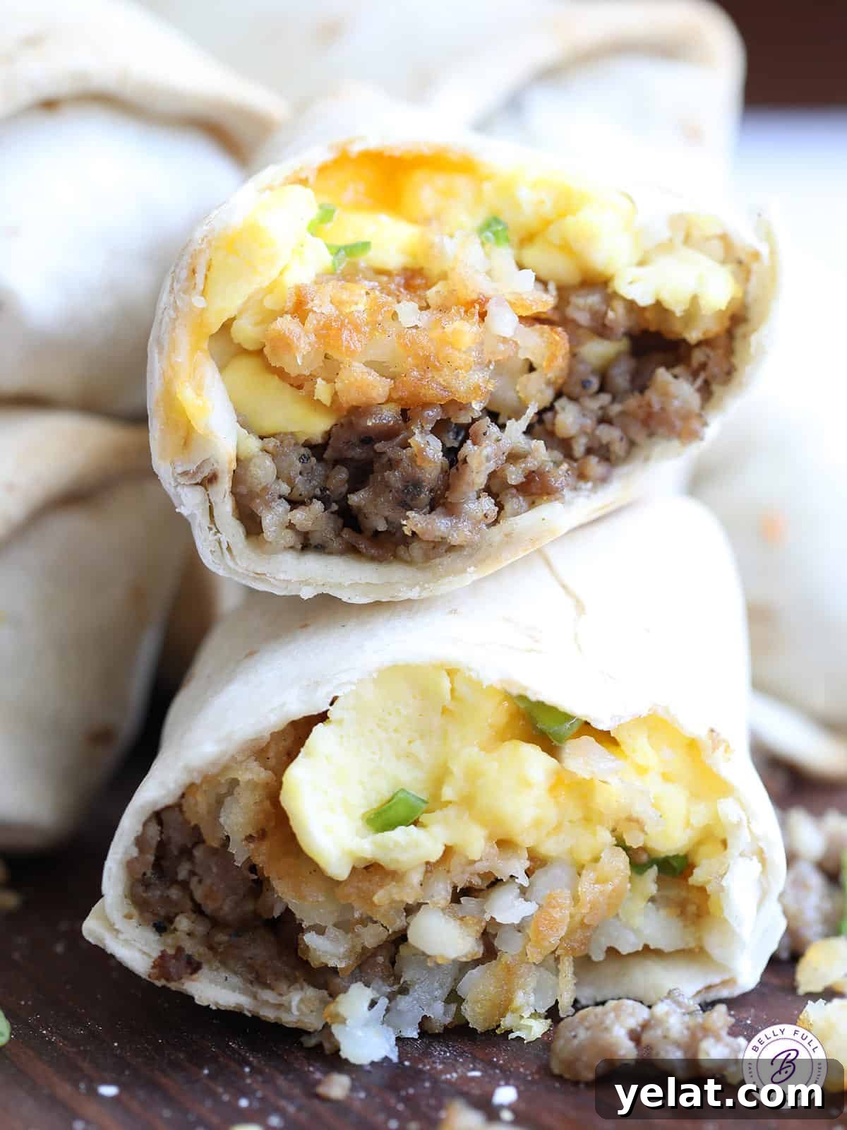 two breakfast burrito halves stacked