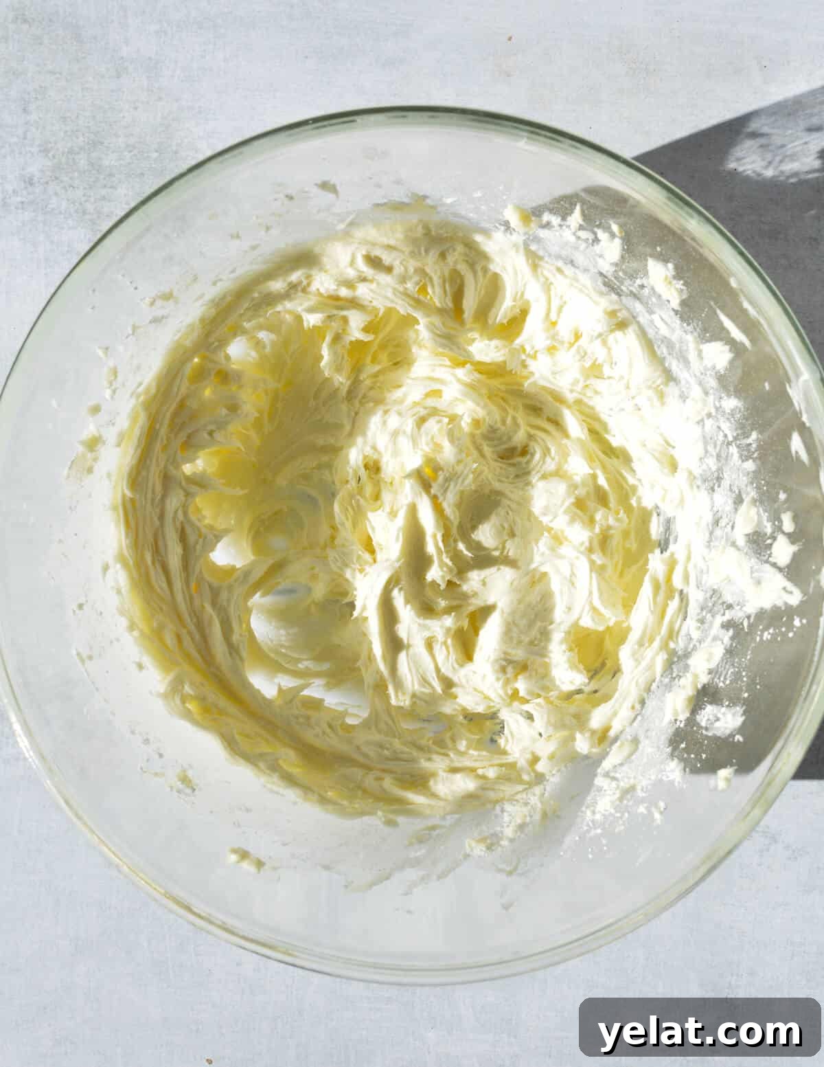 Silky Peppermint Buttercream Frosting Recipe for Cakes & Cupcakes 7 whipped peppermint frosting in a bowl.