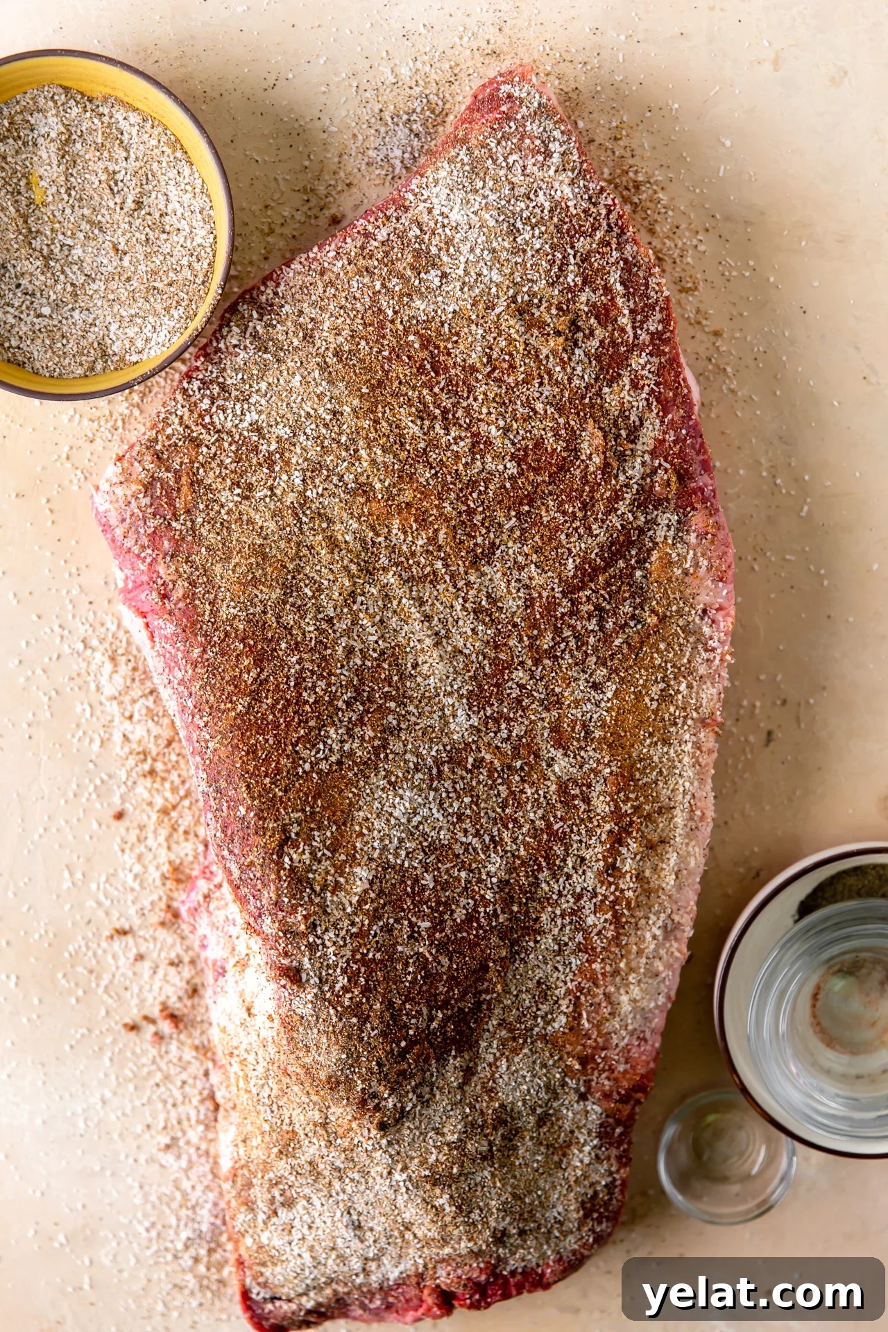 Ultimate Texas-Style Brisket Rub Recipe for Smoky Flavor 6 Brisket sprinkled with a brisket dry rub seasoning.
