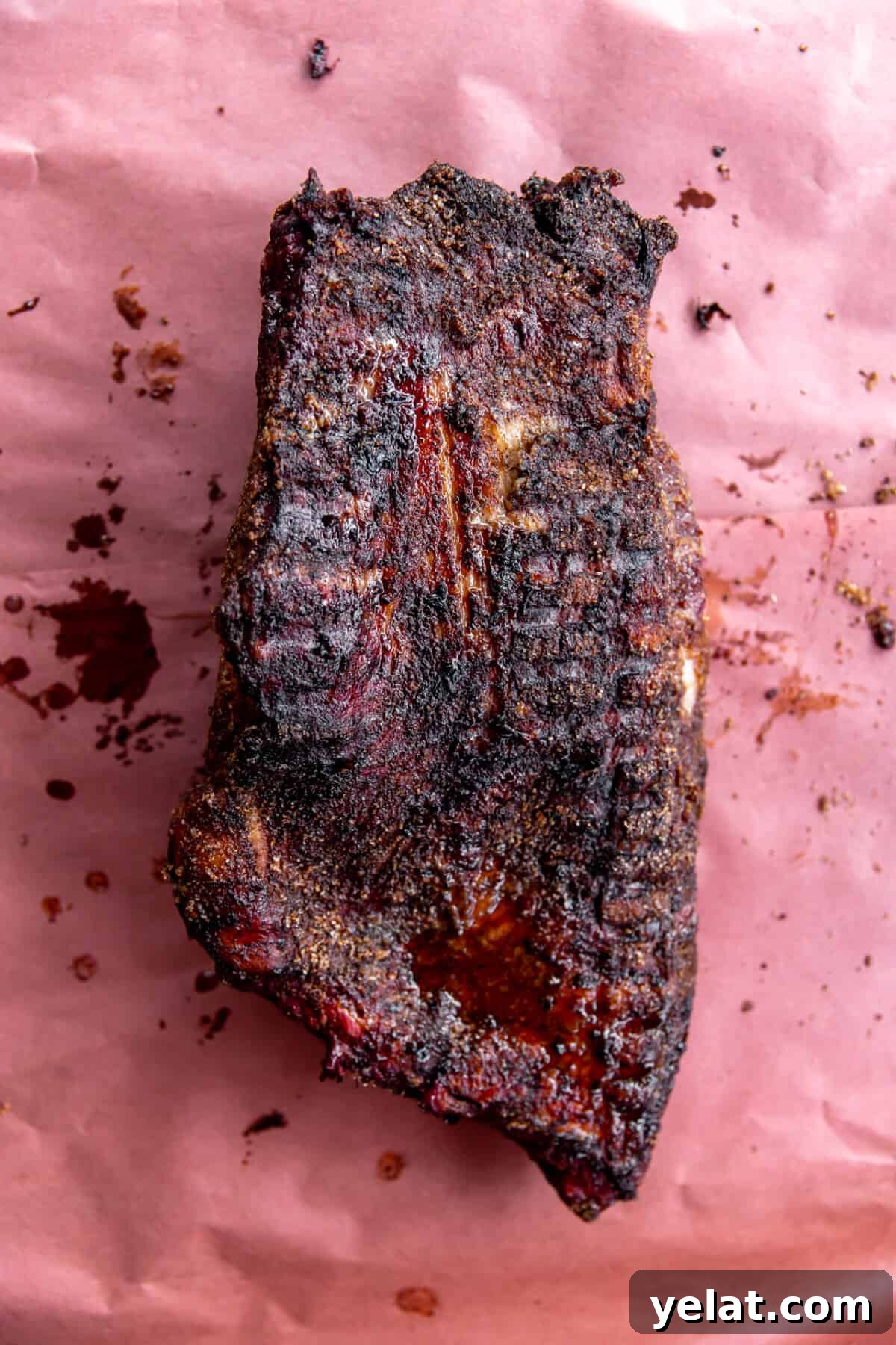 Ultimate Texas-Style Brisket Rub Recipe for Smoky Flavor 7 Smoked brisket laid on a piece of butcher paper.