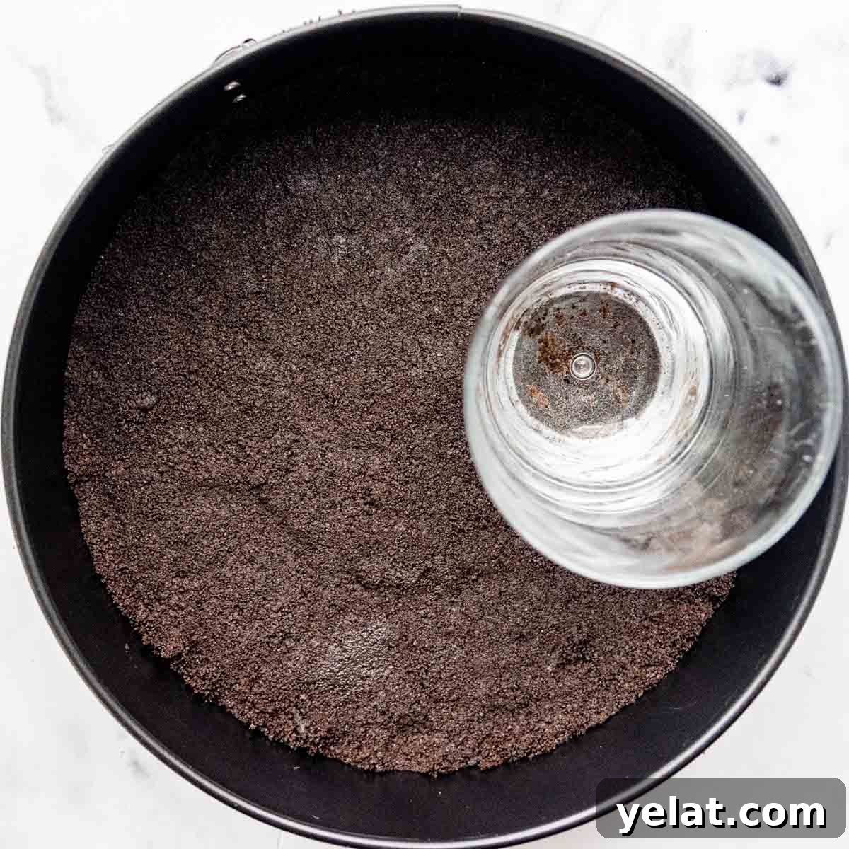 Ultra-Cream Gluten-Free Oreo Cheesecake Recipe 4 oreos pressed into a cheesecake pan
