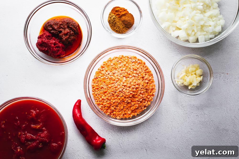 Ingredients for harissa and red lentil soup arranged in glass bowls.