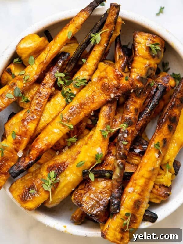 mustard maple glazed parsnips in white bowl on backdrop