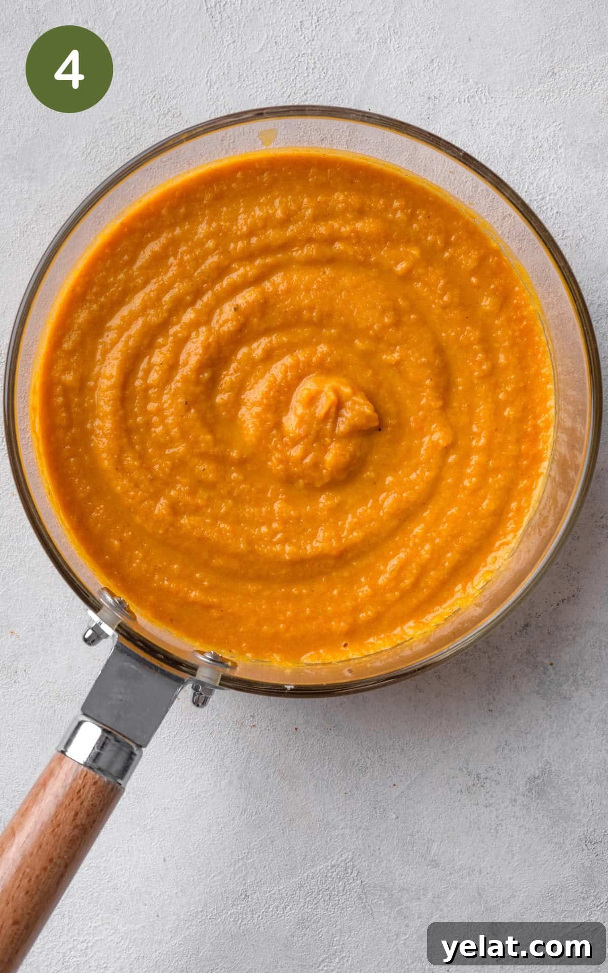 Creamy Carrot and Parsnip Soup Recipe for Cozy Meals 7 blended soup in a pot.