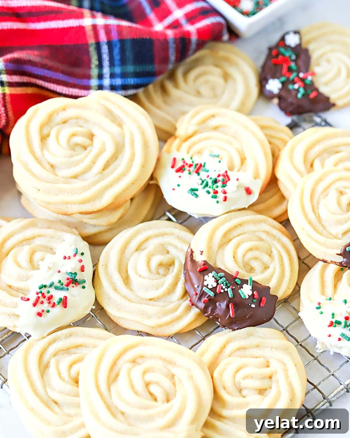 Classic Old-Fashioned Butter Cookies Recipe 3 Butter cookies dipped in chocolate.