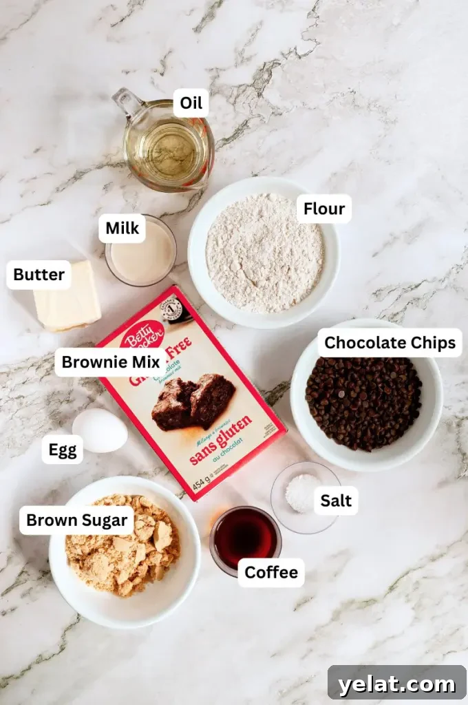 Cookie Dough Brownies with Gluten-Free & Dairy-Free Options 3 Dark brown fudgy brownies with chunks of edible cookie dough and topped with a thick layer of cookie dough on top.