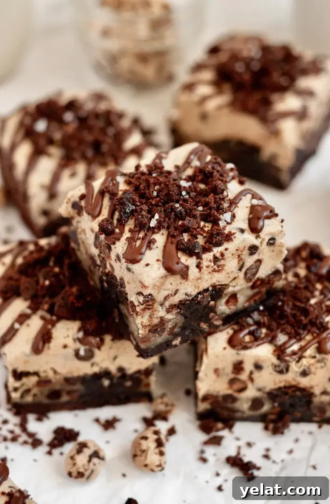 Cookie Dough Brownies with Gluten-Free & Dairy-Free Options 5 Dark brown fudgy brownies with chunks of edible cookie dough and topped with a thick layer of cookie dough on top.